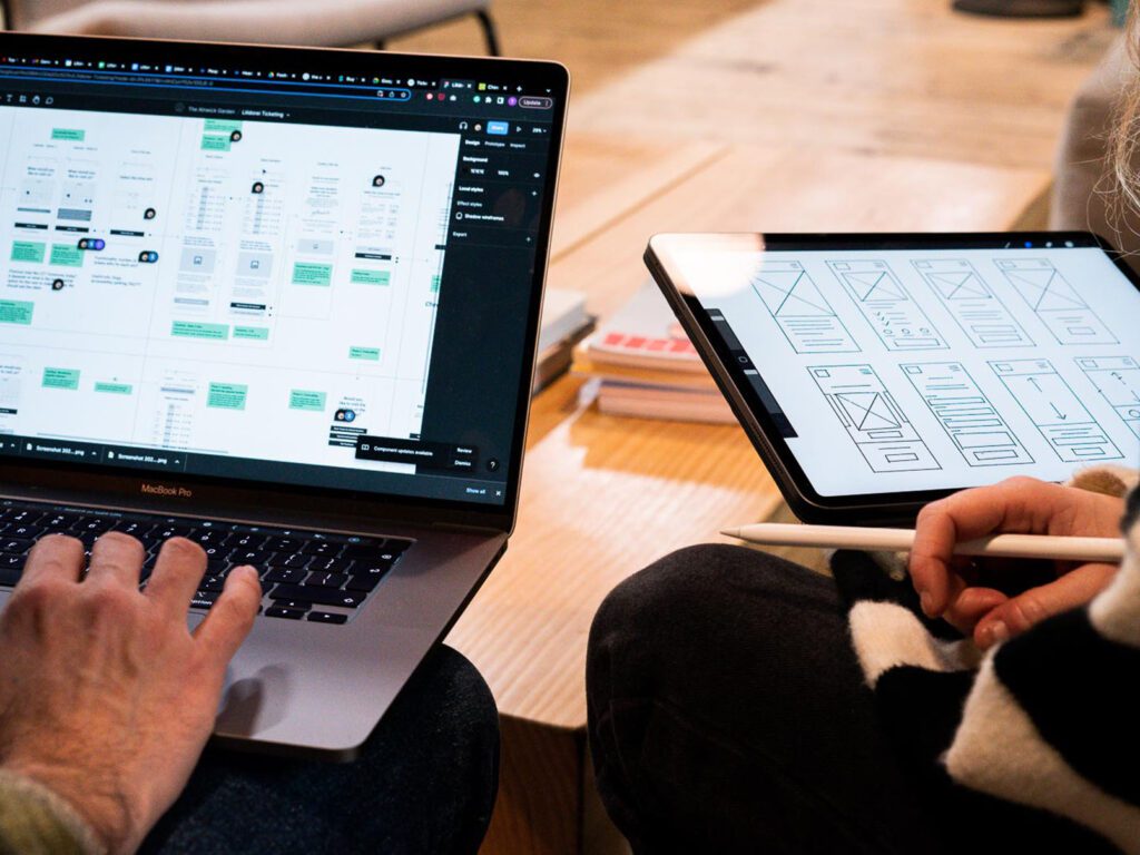 Two laptops with sketches on