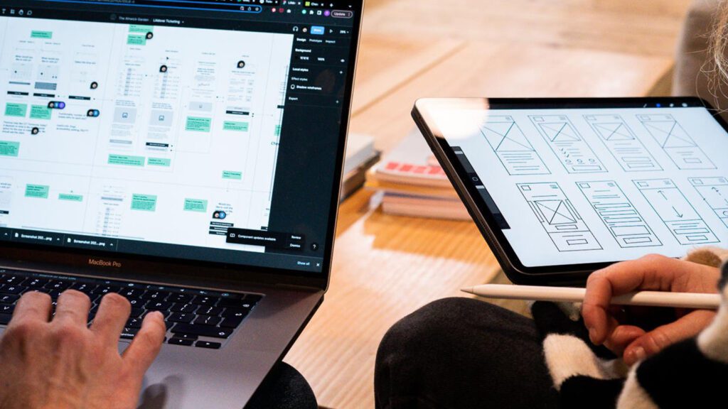 Two laptops with sketches on