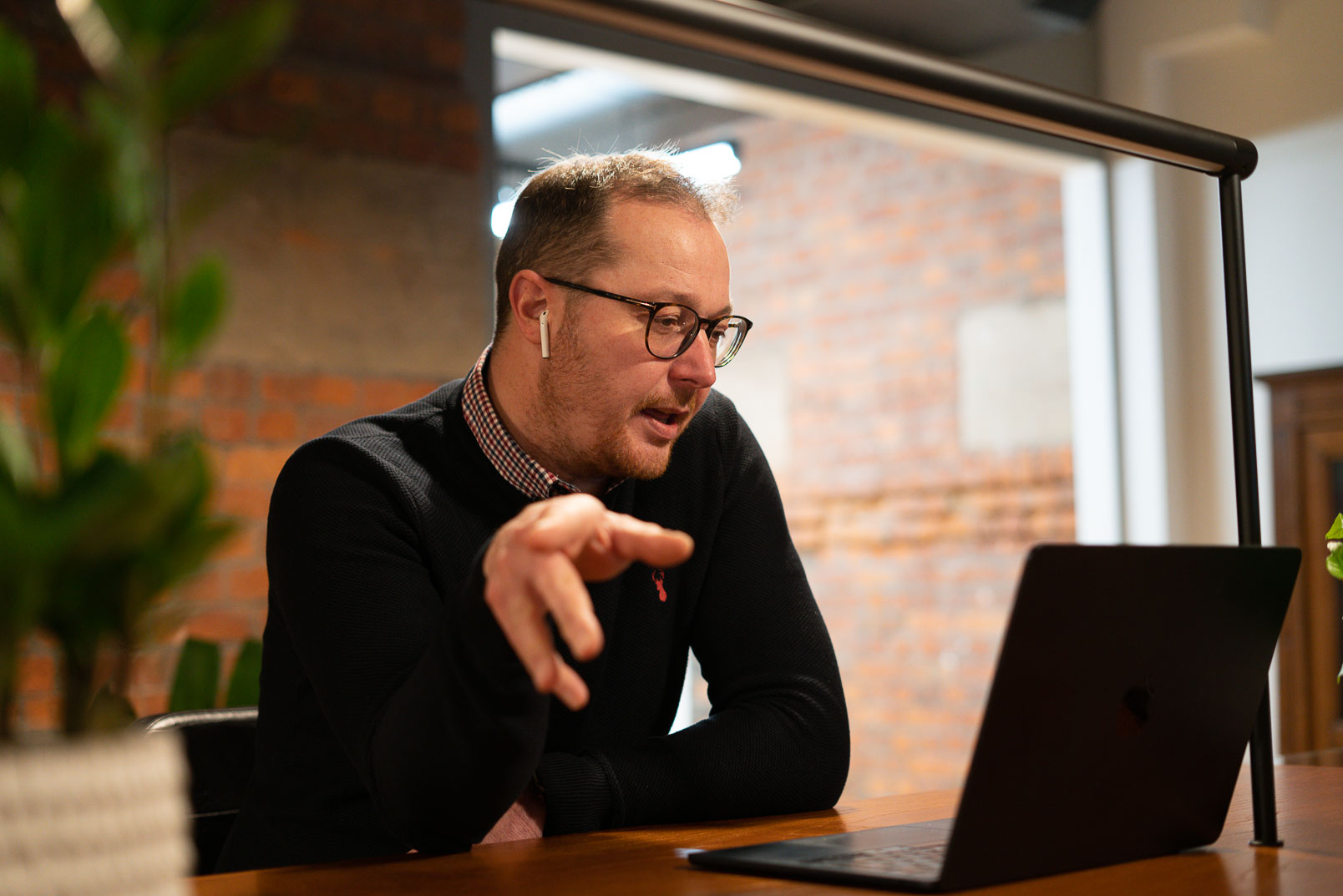 Man on a virtual call with headphones in