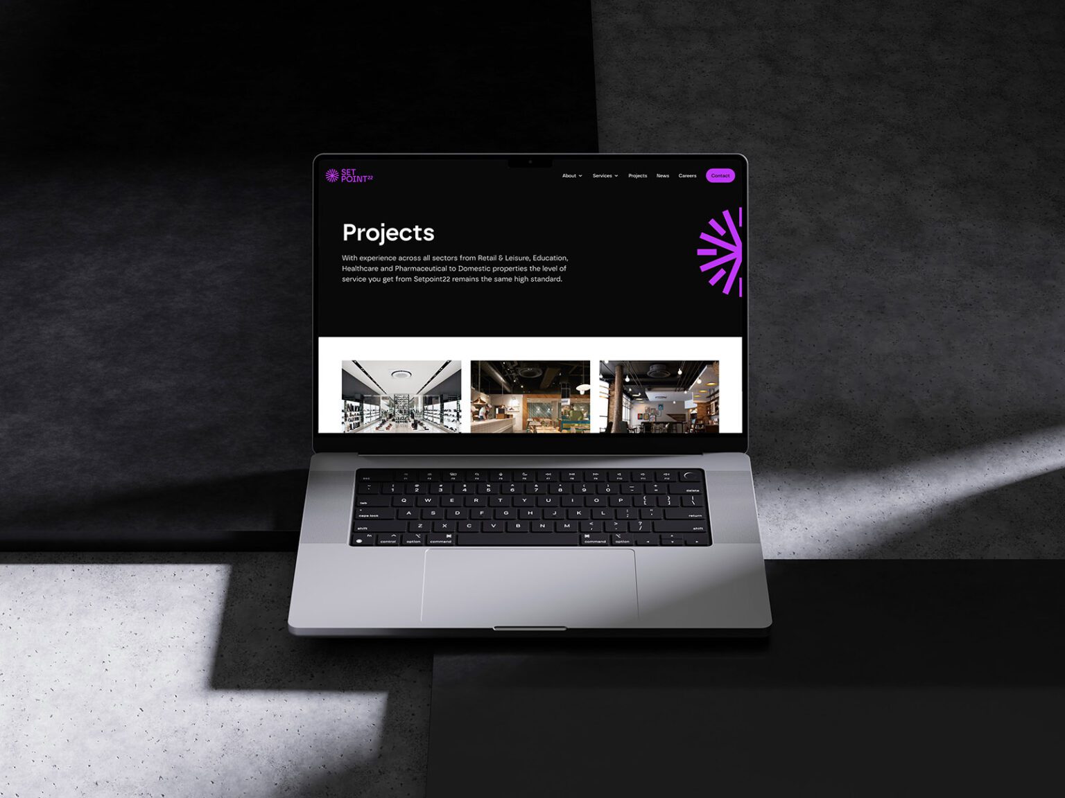 A laptop showing new website design for SetPoint22.