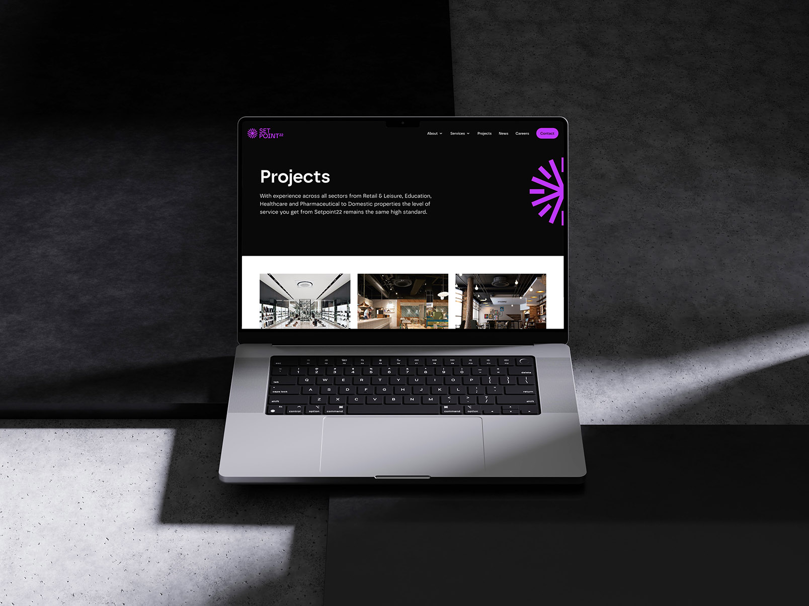 A laptop showing new website design for SetPoint22.