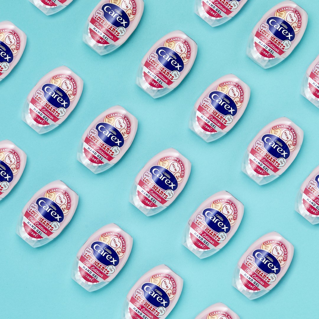 Carex Love Hearts mini hand sanitisers in a grid pattern.