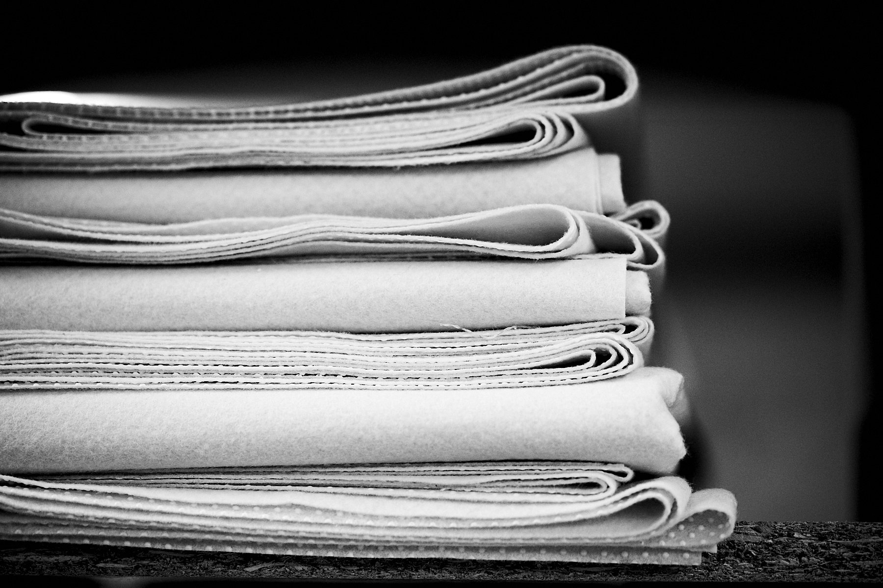 Pile of neatly folded fabrics.