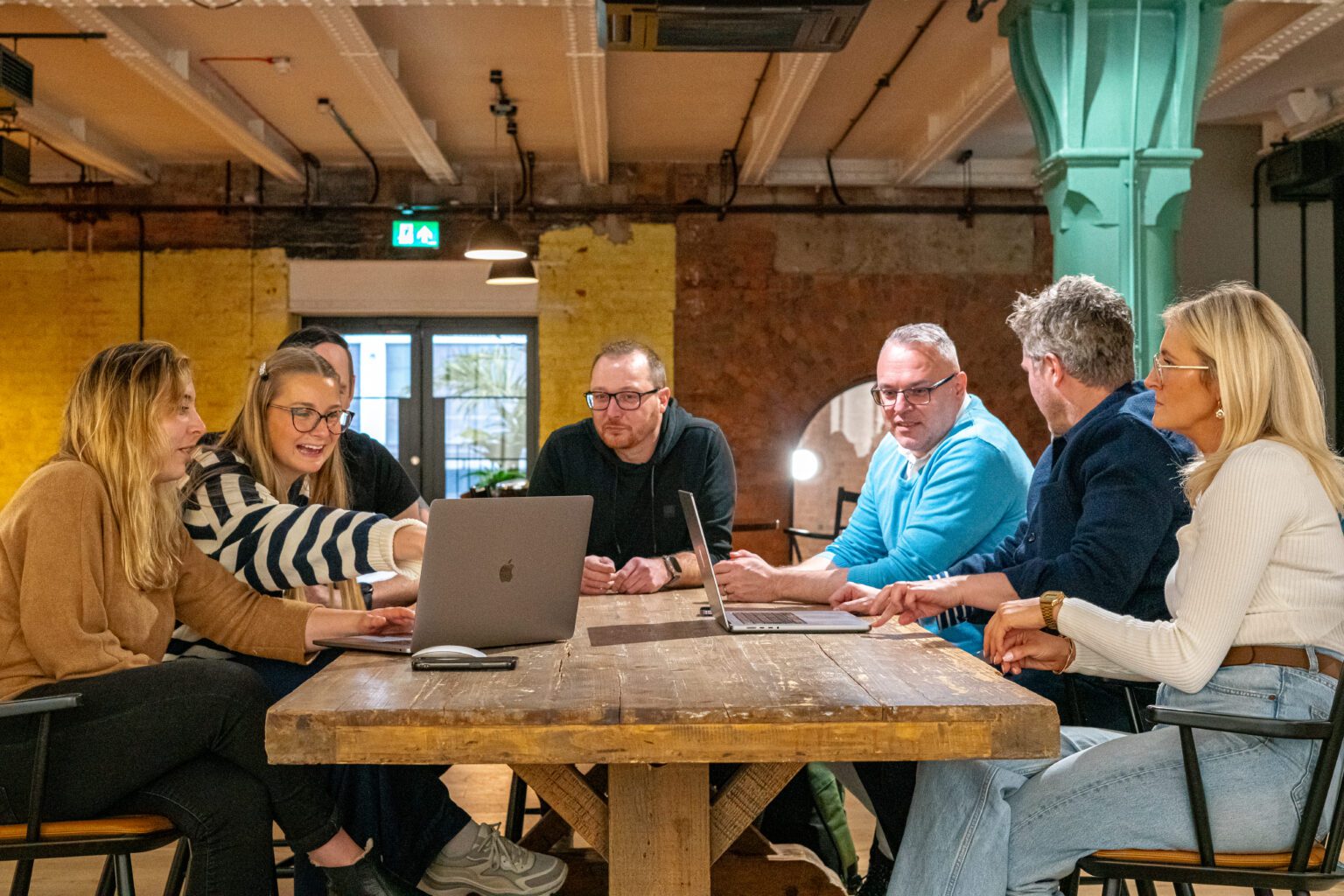 A team of Ultimate colleagues collaborating.