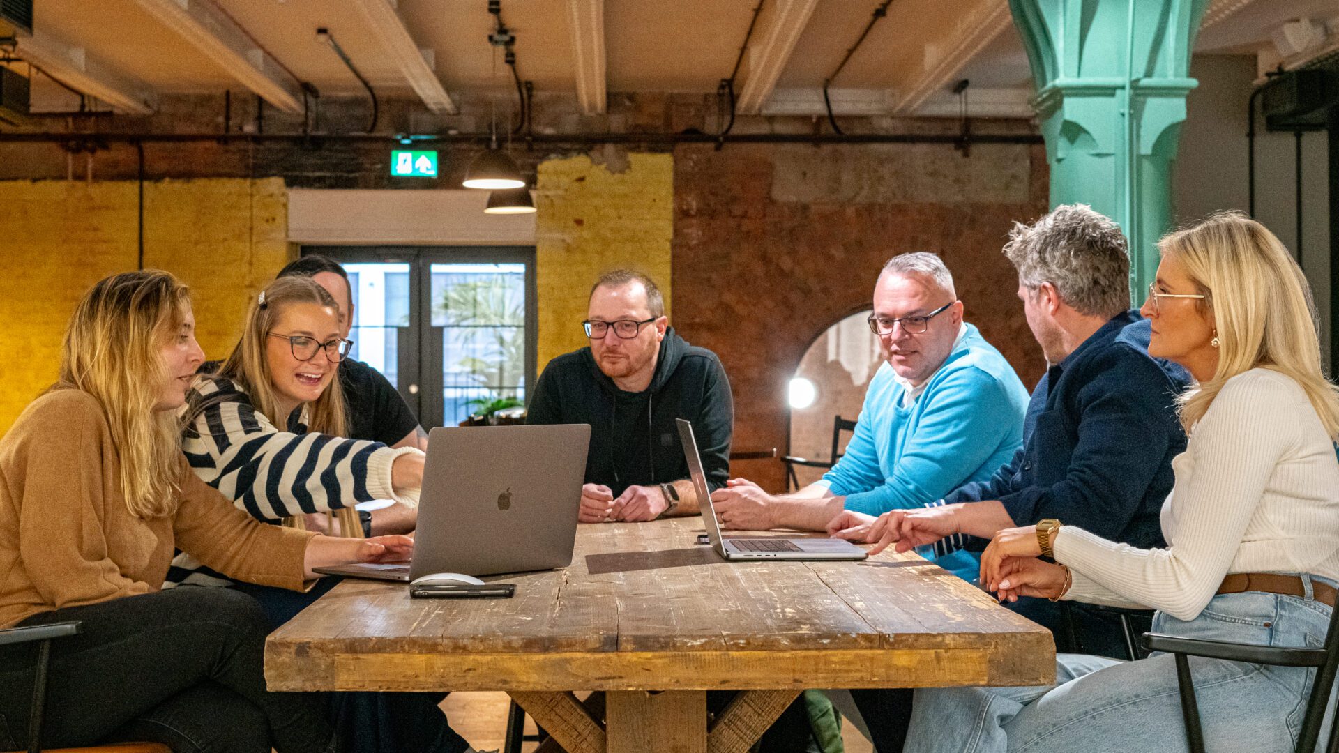 A team of Ultimate colleagues collaborating.